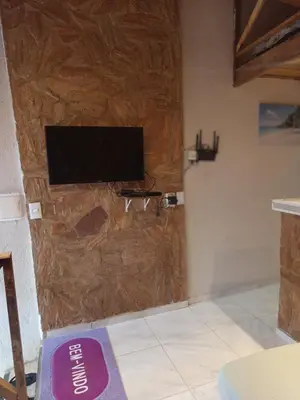 Uma televisão e/ou sistema de entretenimento em Casa Refúgio do Alto