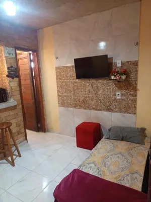 Uma televisão e/ou sistema de entretenimento em Casa Refúgio do Alto