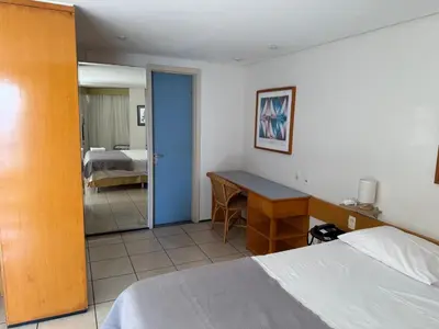 Uma cama ou camas num quarto em Flat - Iate Plaza Hotel