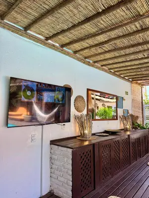 Uma televisão e/ou sistema de entretenimento em Villa Puglia Jeri