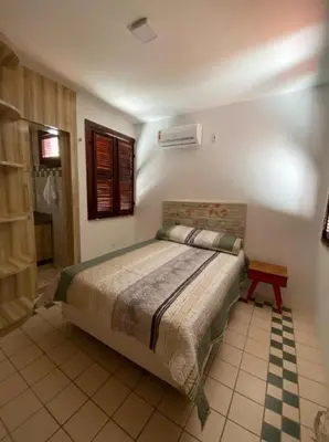 Uma cama ou camas num quarto em Casa de Condomínio em Porto das Dunas