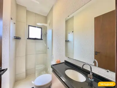 Uma casa de banho em Beachfront Duplex B por Be My Guest