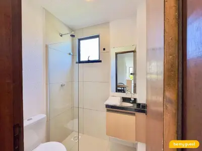Uma casa de banho em Beachfront Duplex B por Be My Guest
