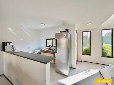 A cozinha ou kitchenette de Beachfront Duplex B por Be My Guest