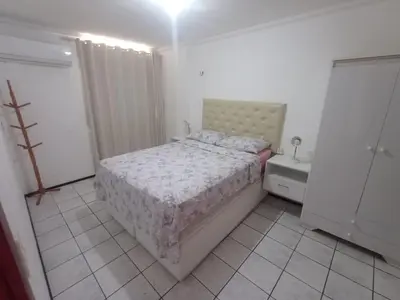 Uma cama ou camas num quarto em Flat Beira Mar