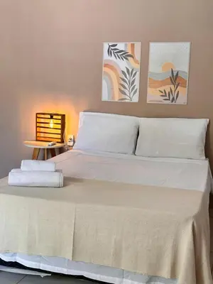 Uma cama ou camas num quarto em Maruá Pousada da Lagoa