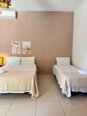 Uma cama ou camas num quarto em Maruá Pousada da Lagoa