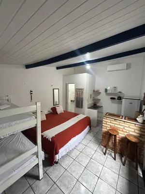 Uma cama ou camas num quarto em Suite Canoa azul 1