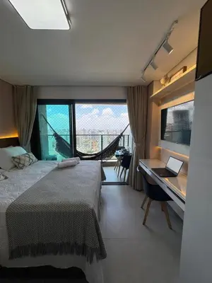 Uma cama ou camas num quarto em Studio moderno e equipado, a poucos passos da Beira Mar