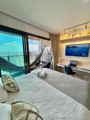 Uma cama ou camas num quarto em Studio moderno e equipado, a poucos passos da Beira Mar
