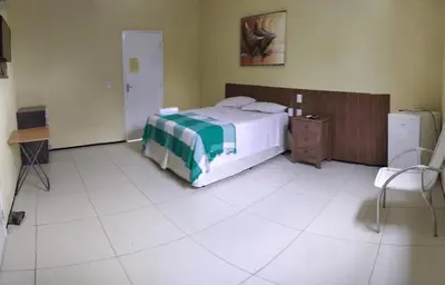 Uma cama ou camas num quarto em Pousada Itarema Residence