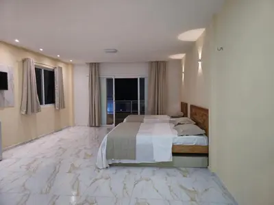Uma cama ou camas num quarto em Pousada Itarema Residence