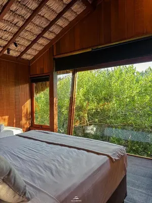 Uma cama ou camas num quarto em Vila Moitas Casa TUPI