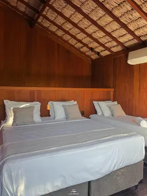 Uma cama ou camas num quarto em Vila Moitas Casa TUPI