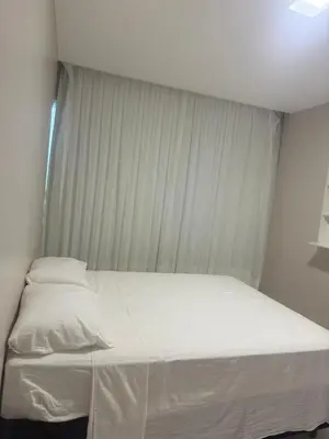 Uma cama ou camas num quarto em Casa da Maré Pé na areia Suítes climatizadas e deck vista mar