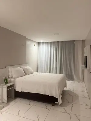Uma cama ou camas num quarto em Casa da Maré Pé na areia Suítes climatizadas e deck vista mar