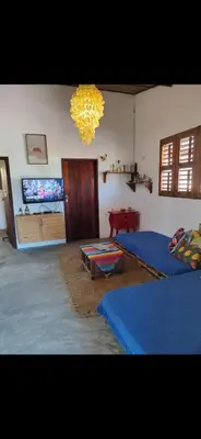 Uma televisão e/ou sistema de entretenimento em Casa Ma Cherie Jericoacara