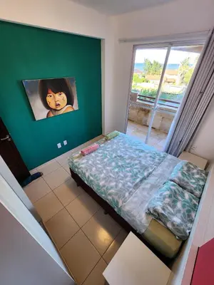 Uma cama ou camas num quarto em Cumbuco Residence - O Rei Do Cumbuco