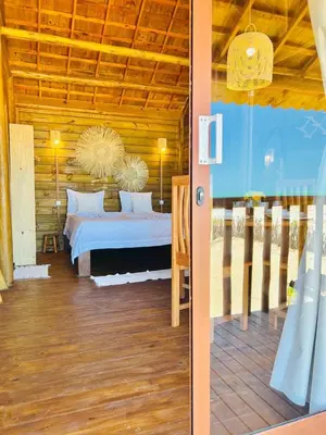 Uma cama ou camas num quarto em Chalet Paraiso Canoa 3 na praia - Canoa Quebrada