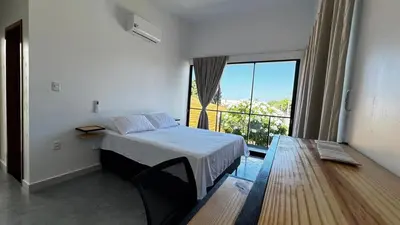 Uma cama ou camas num quarto em Chalés da Bica - Modernidade e Aconchego a 100m da Praia