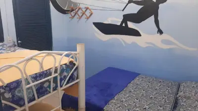 Uma cama ou camas num quarto em Hostel Green house beach