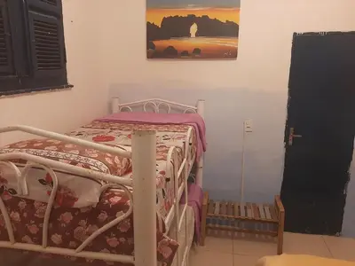 Uma cama ou camas num quarto em Hostel Green house beach