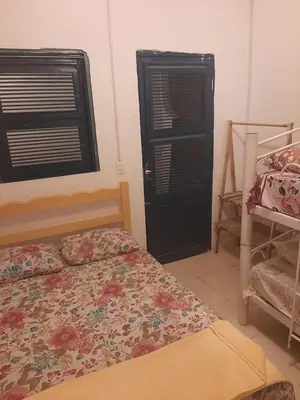 Uma cama ou camas num quarto em Hostel Green house beach