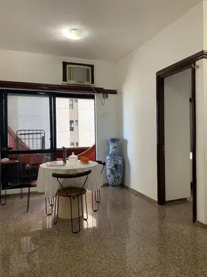 Uma área de estar em Flat Villa Costeira - Vista Lateral Mar