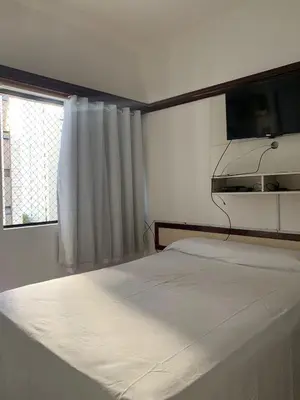 Uma cama ou camas num quarto em Flat Villa Costeira - Vista Lateral Mar