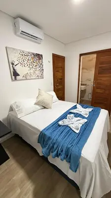Uma cama ou camas num quarto em AP 104 com Piscina e Churrasqueira - Canoas Flecheiras