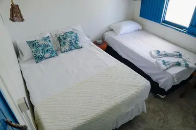 Uma cama ou camas num quarto em Tulum House Ilha do guajiru, Itarema