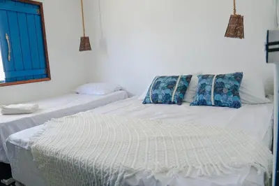 Uma cama ou camas num quarto em Tulum House Ilha do guajiru, Itarema