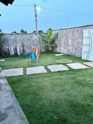 Um jardim no exterior de Casa por do sol Flecheiras