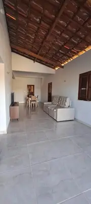 Uma área de estar em Casa por do sol Flecheiras