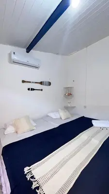 Uma cama ou camas num quarto em Suite Canoa Azul 2
