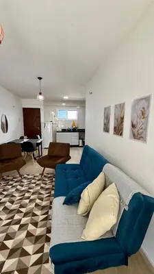 Uma área de estar em Beach Place ACONCHEGO e refúgio perto do mar
