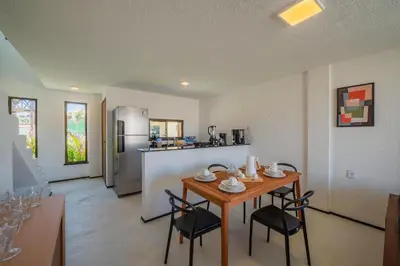 A cozinha ou kitchenette de Beachfront Duplex Pé na Areia By Carpediem