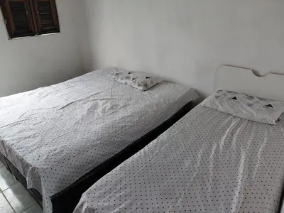 Uma cama ou camas num quarto em Apartamento Sunset Canindé