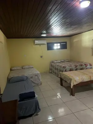 Uma cama ou camas num quarto em Casa fazenda Paracuru