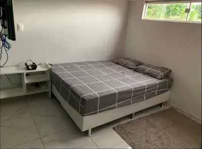 Uma cama ou camas num quarto em Loft Moderno Aconchegante e Confortável