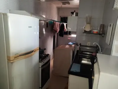 A cozinha ou kitchenette de Apartamento totalmente mobiliado