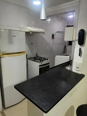 A cozinha ou kitchenette de Apartamento totalmente mobiliado