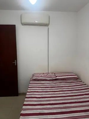Uma cama ou camas num quarto em Apartamento totalmente mobiliado