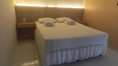 Uma cama ou camas num quarto em Pousada Use Sabor Caseiro