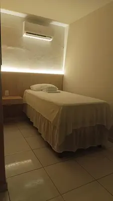 Uma cama ou camas num quarto em Pousada Use Sabor Caseiro