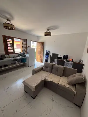 Uma área de estar em Cozy Condo Preá Beira-mar