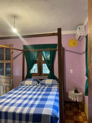 Uma cama ou camas num quarto em Casa Maria Bonita
