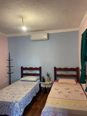 Uma cama ou camas num quarto em Casa Maria Bonita