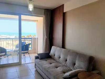 Uma área de estar em Apartamento à beira-mar na Praia do Futuro