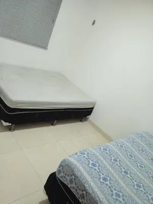 Uma cama ou camas num quarto em Condomínio tropicaliente